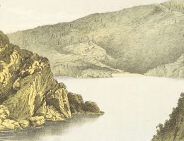 grayscale photo of mountain near body of water