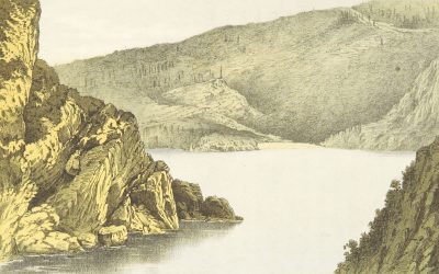 grayscale photo of mountain near body of water